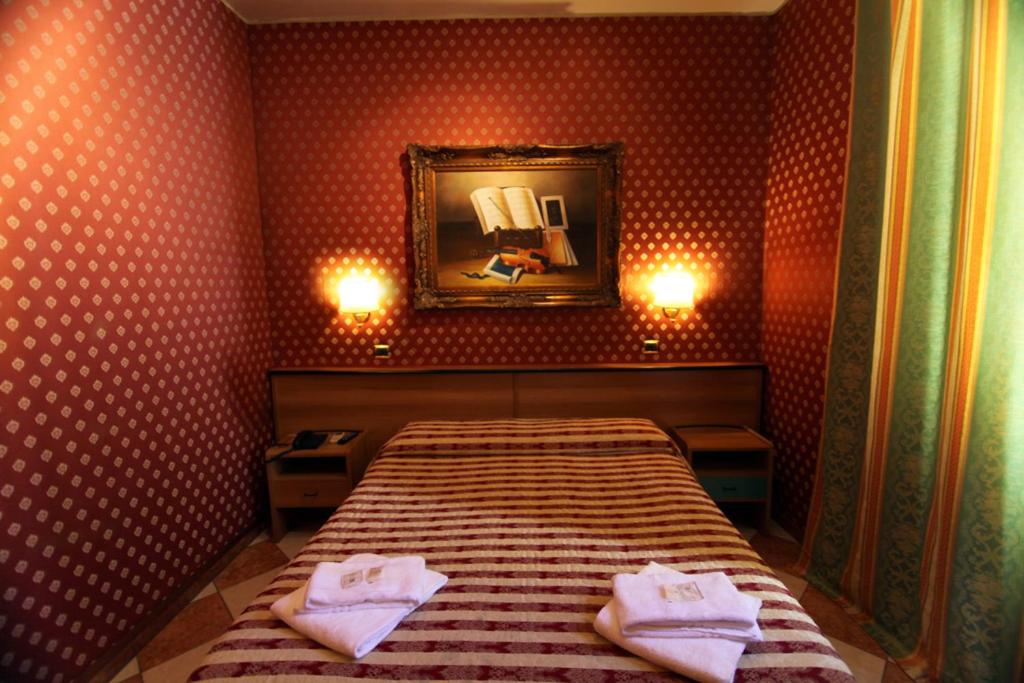Postel nebo postele na pokoji v ubytování Hotel Hollywood