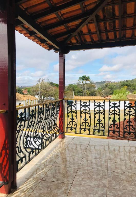 a view from the balcony of a house with a gate at Solar da Vila in Tiradentes