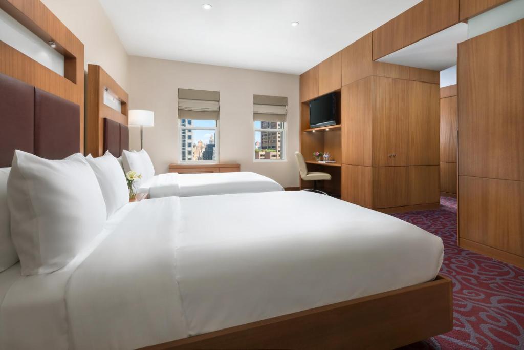 Postel nebo postele na pokoji v ubytování Hotel 57