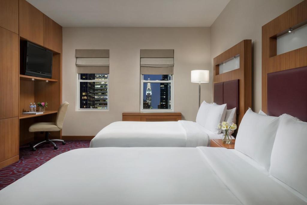 Postel nebo postele na pokoji v ubytování Hotel 57