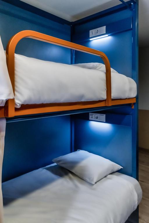 Cama ou camas em um quarto em Latroupe Poblenou Beach