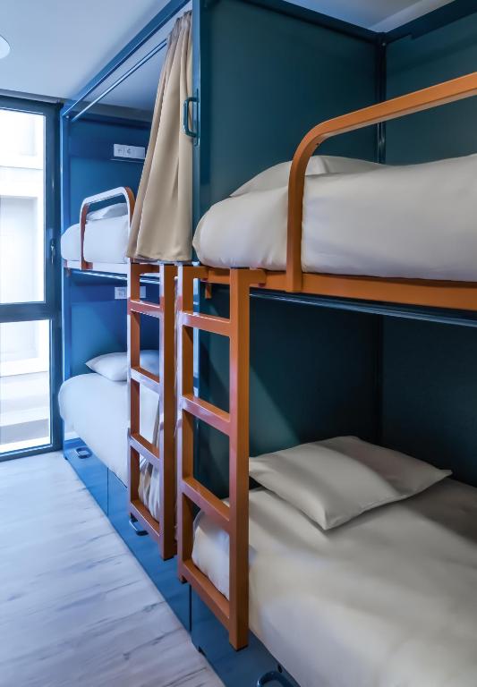 Cama ou camas em um quarto em Latroupe Poblenou Beach