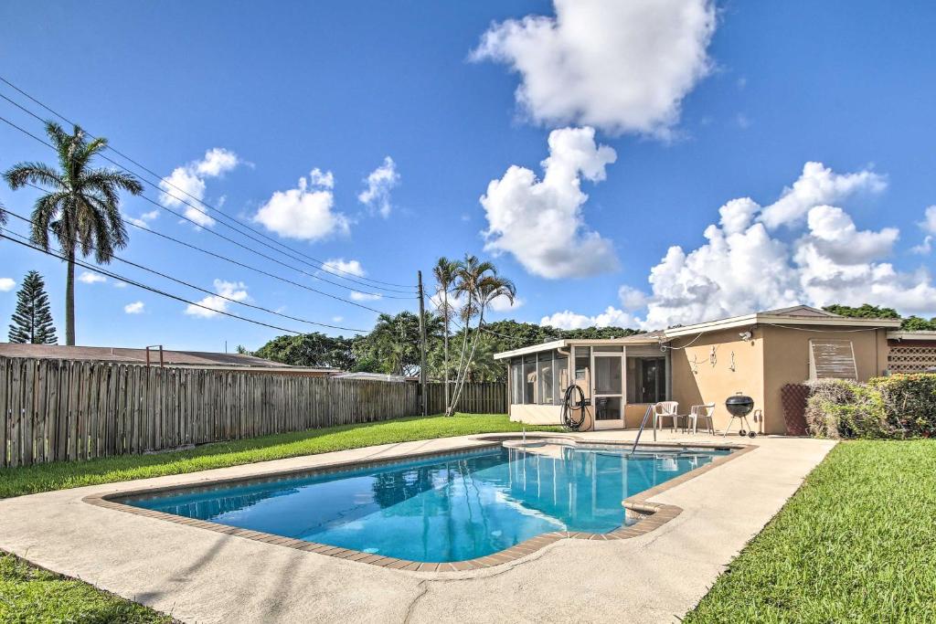 a swimming pool in the yard of a house at Pet-Friendly Margate House with Private Pool! in Margate