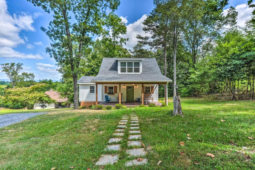 a small house with a pathway leading to the front yard at Peaceful Virginia Cabin - Fish, Tube, Boat, Etc! in Edinburg