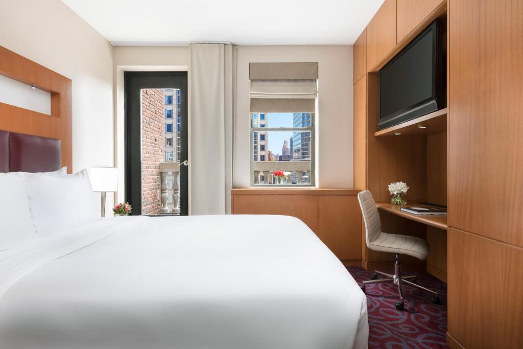 Postel nebo postele na pokoji v ubytování Hotel 57