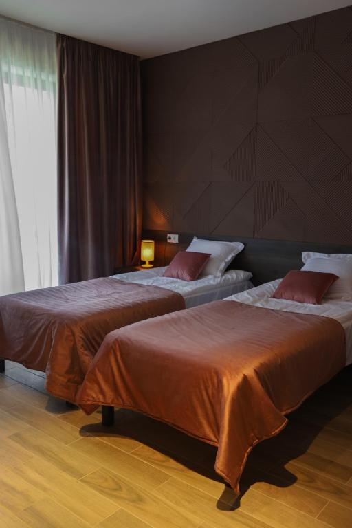 Postel nebo postele na pokoji v ubytování Hotel INSIDE Kazbegi