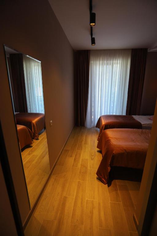 Postel nebo postele na pokoji v ubytování Hotel INSIDE Kazbegi