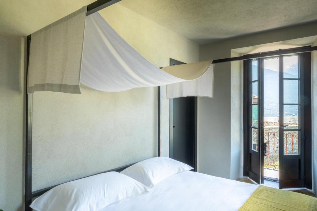 Postel nebo postele na pokoji v ubytování Agriturismo Olmo