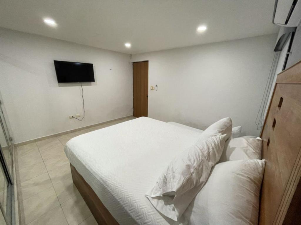 Postel nebo postele na pokoji v ubytování Casa con alberca en el centro de Puerto Progreso