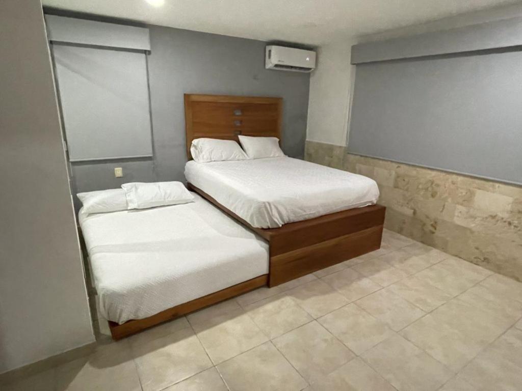 Postel nebo postele na pokoji v ubytování Casa con alberca en el centro de Puerto Progreso