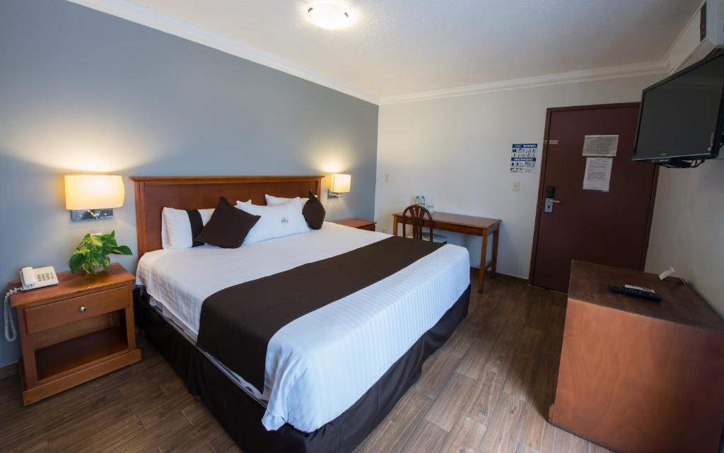 Postel nebo postele na pokoji v ubytování Del Marques Hotel and Suites
