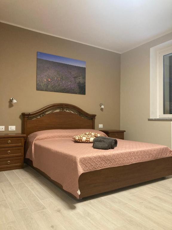 A bed or beds in a room at IL CORTILE DI GRETA
