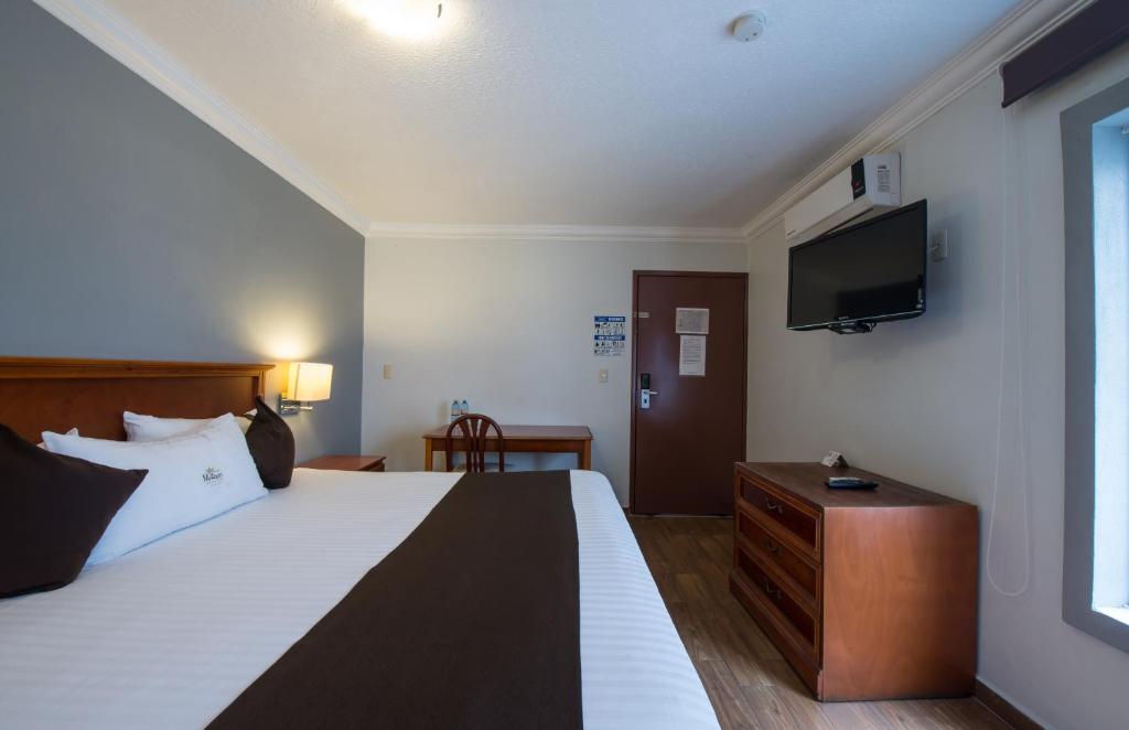 Postel nebo postele na pokoji v ubytování Del Marques Hotel and Suites