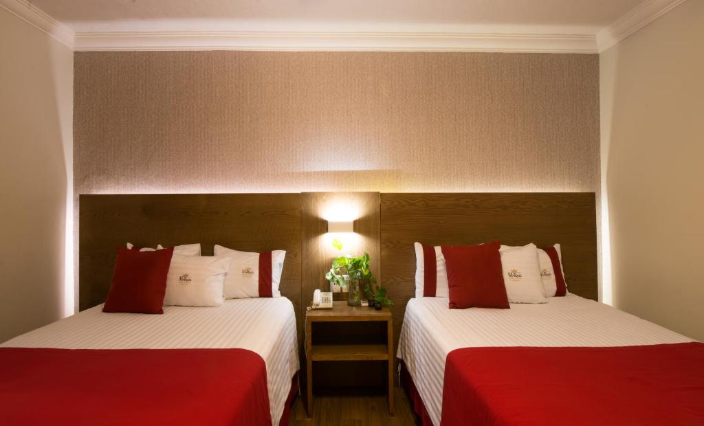 Postel nebo postele na pokoji v ubytování Del Marques Hotel and Suites