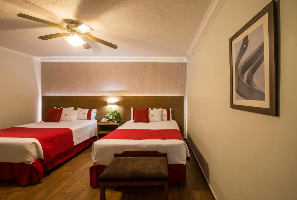 Postel nebo postele na pokoji v ubytování Del Marques Hotel and Suites