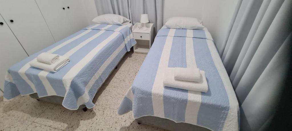 Postel nebo postele na pokoji v ubytování Latchi Area Apartments
