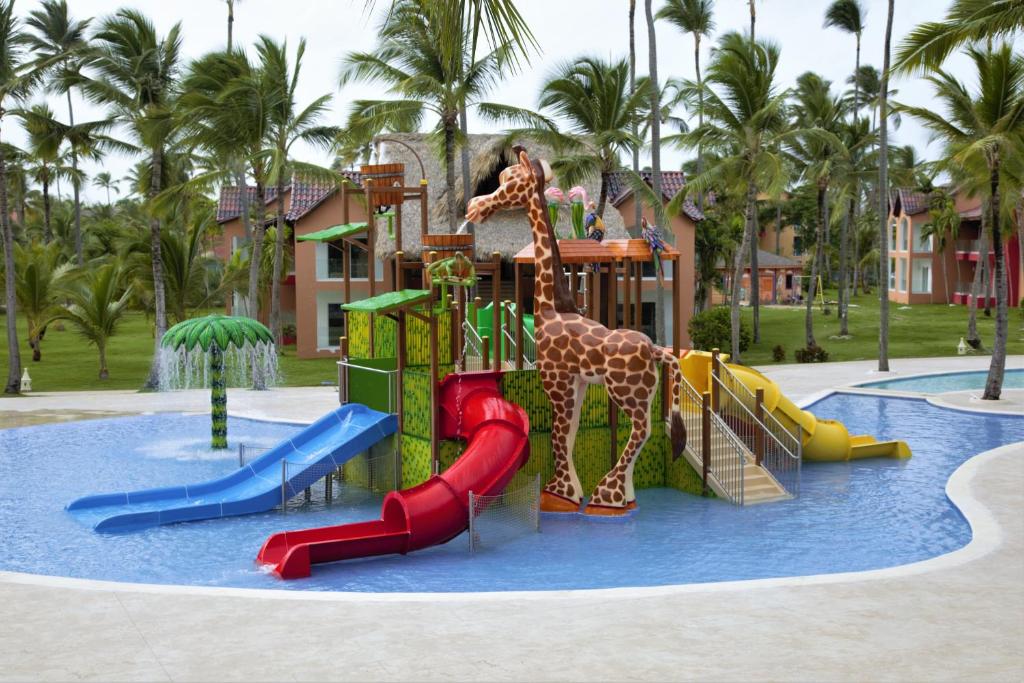 a water park with slides and a giraffe on it at Tropical Deluxe Princess - All Inclusive in Punta Cana