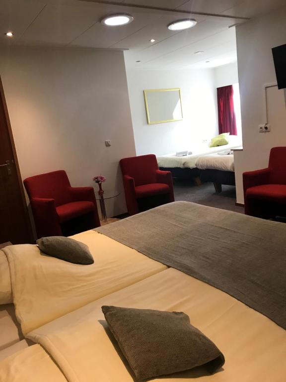 Postel nebo postele na pokoji v ubytování Hotel Het Landhuis