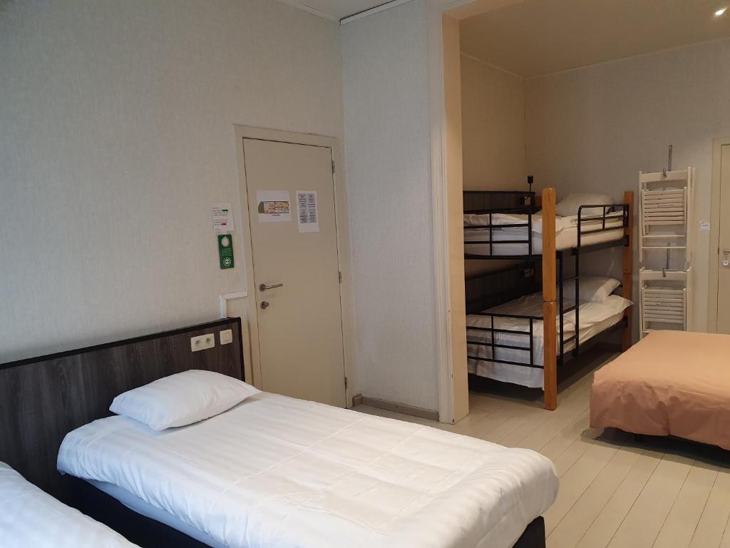Postel nebo postele na pokoji v ubytování Albert - Rooms