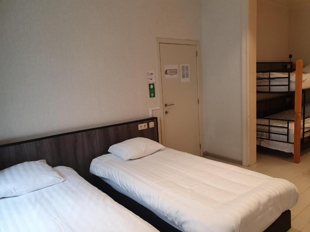 Postel nebo postele na pokoji v ubytování Albert - Rooms