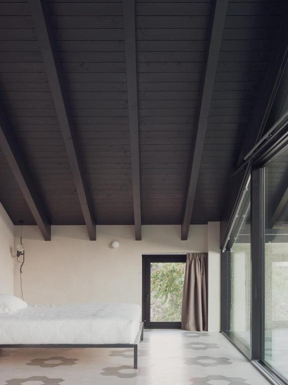 Postel nebo postele na pokoji v ubytování Agriturismo Olmo