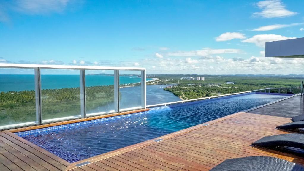 a swimming pool on the roof of a building at Silverton Paiva Experience - Flat in Recife