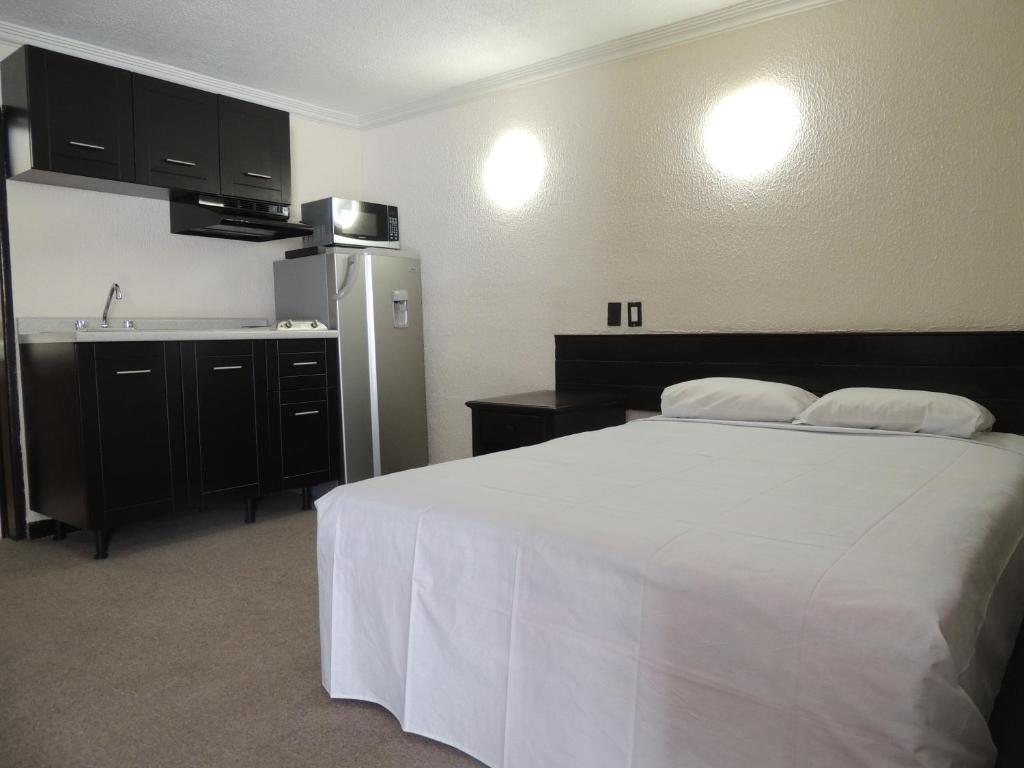 Postel nebo postele na pokoji v ubytování Hotel Lizbeth