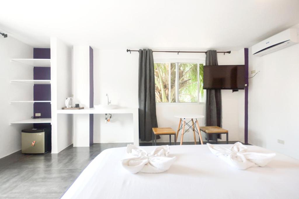 Postel nebo postele na pokoji v ubytování BABOSAM Hotel