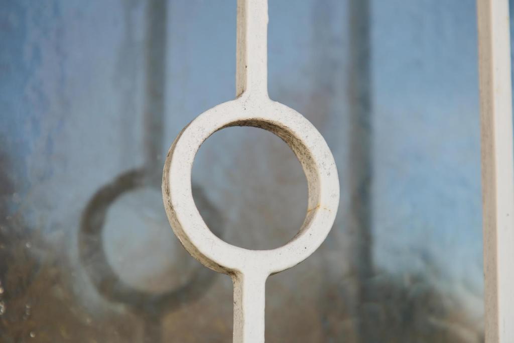 a close up of a metal door with a window at Oh-Apartment Lindenberg in Lindenberg im Allgäu