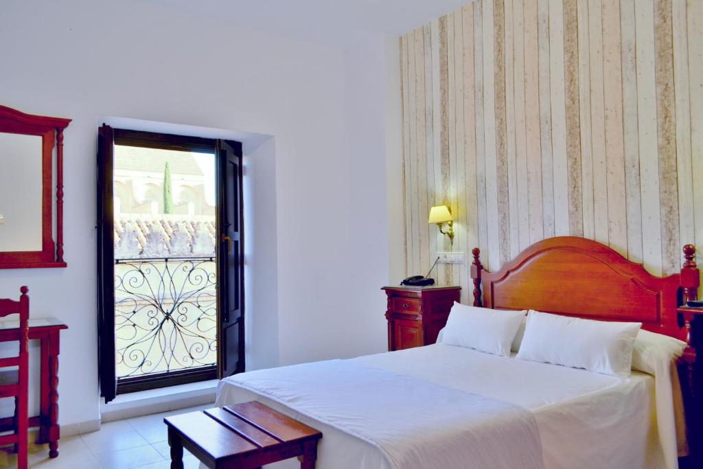 Postel nebo postele na pokoji v ubytování Hotel Marisa