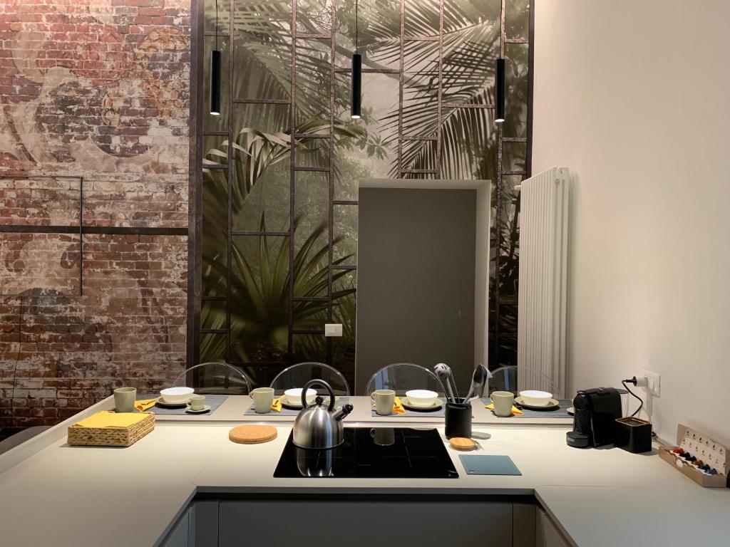 a kitchen with a sink and a counter at Niki O. Charme in Parma