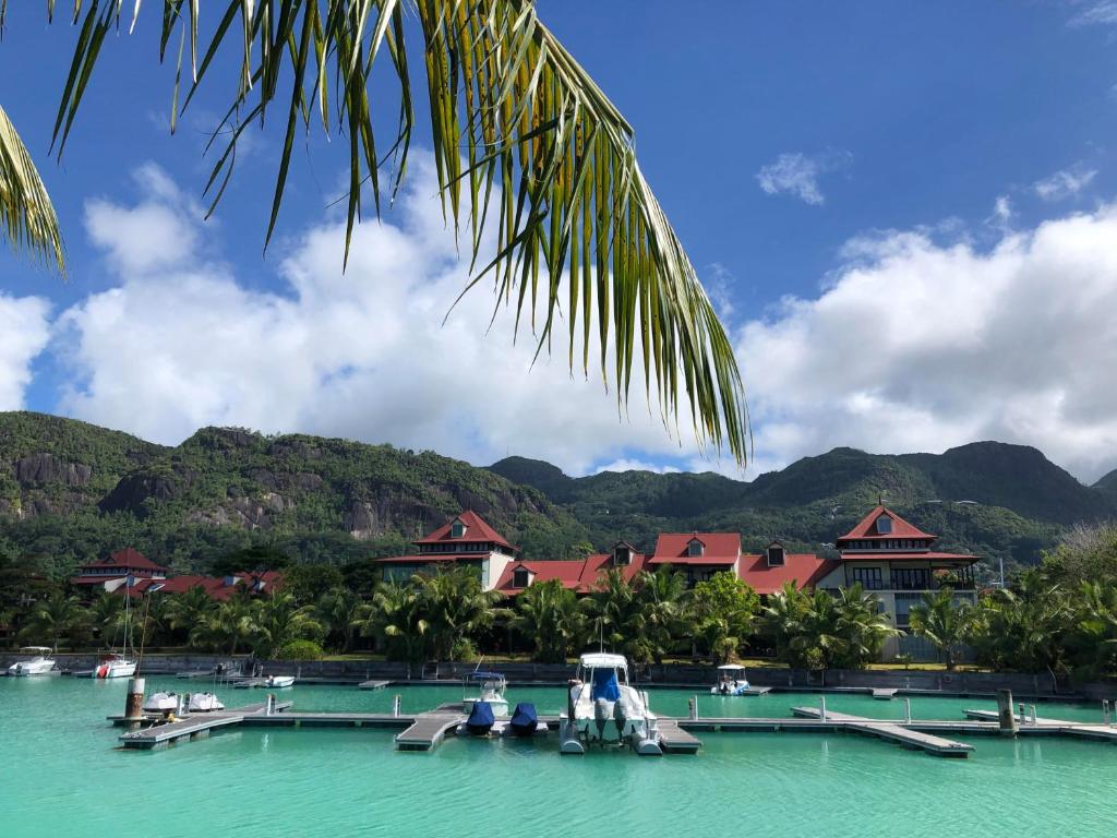 a view of a resort with boats in the water at Eden Confort in Eden Island