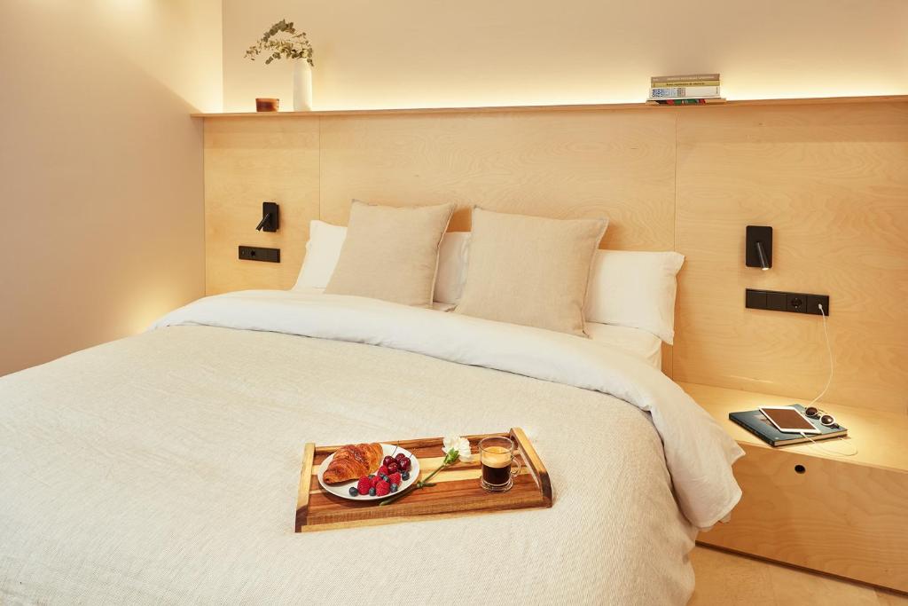 Postel nebo postele na pokoji v ubytování Vip House Ainsa
