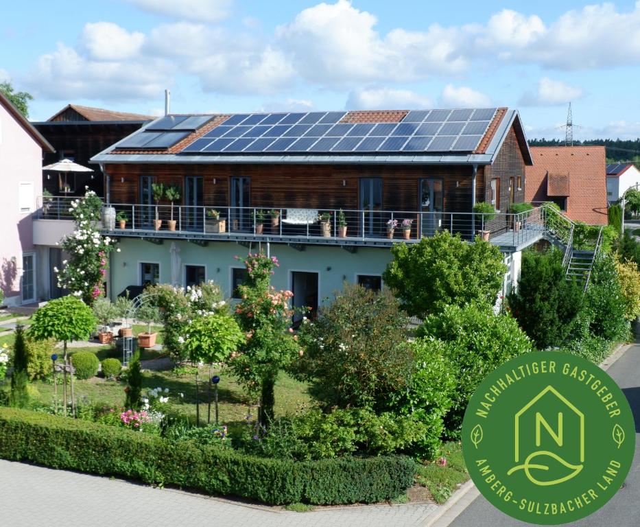 a house with solar panels on the roof at HOF ELF in Ursensollen