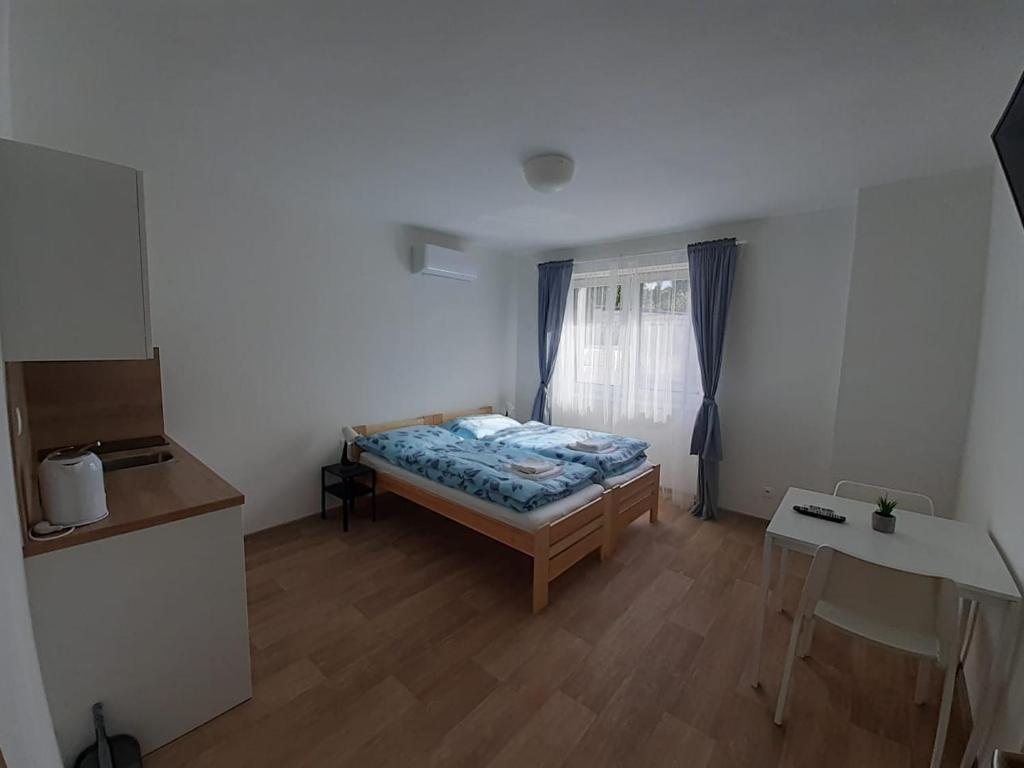 Voodi või voodid majutusasutuse Valen apartmány Valtice toas