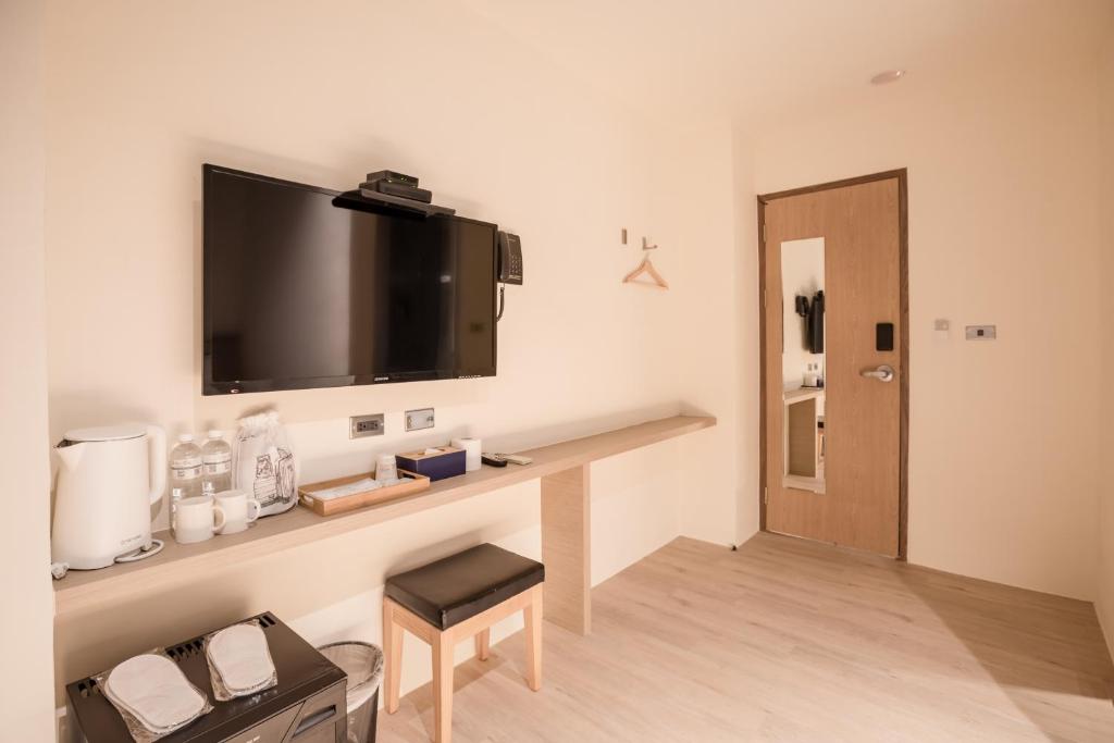 TV a/nebo společenská místnost v ubytování Traveller-Inn Day Moon Hotel