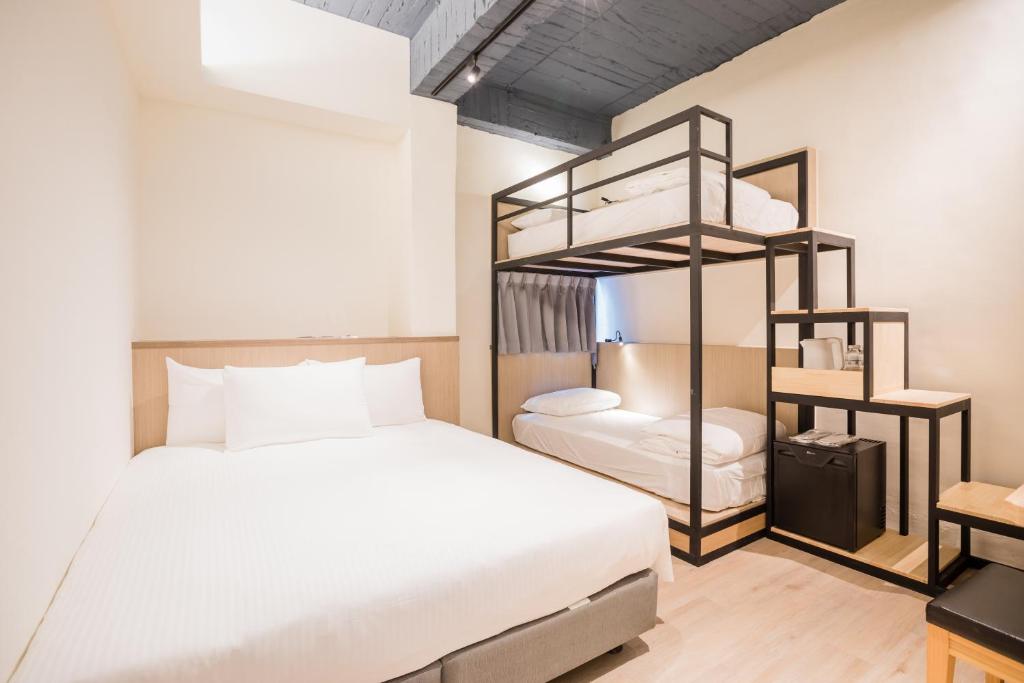 Postel nebo postele na pokoji v ubytování Traveller-Inn Day Moon Hotel