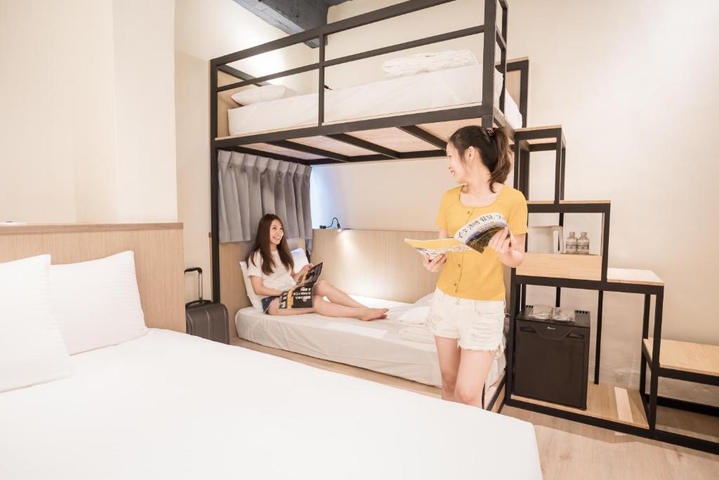 Postel nebo postele na pokoji v ubytování Traveller-Inn Day Moon Hotel