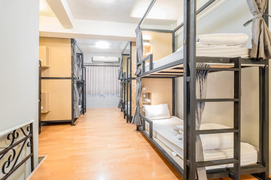 Postel nebo postele na pokoji v ubytování Traveller-Inn Day Moon Hotel