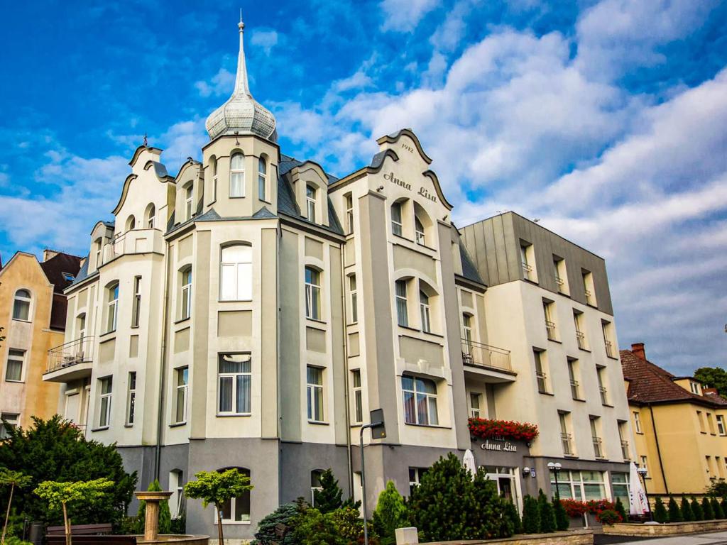 a large white building with a spire on top of it at Villa Anna Lisa in Świnoujście