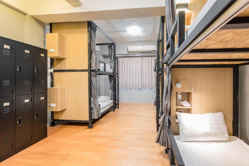 Postel nebo postele na pokoji v ubytování Traveller-Inn Day Moon Hotel