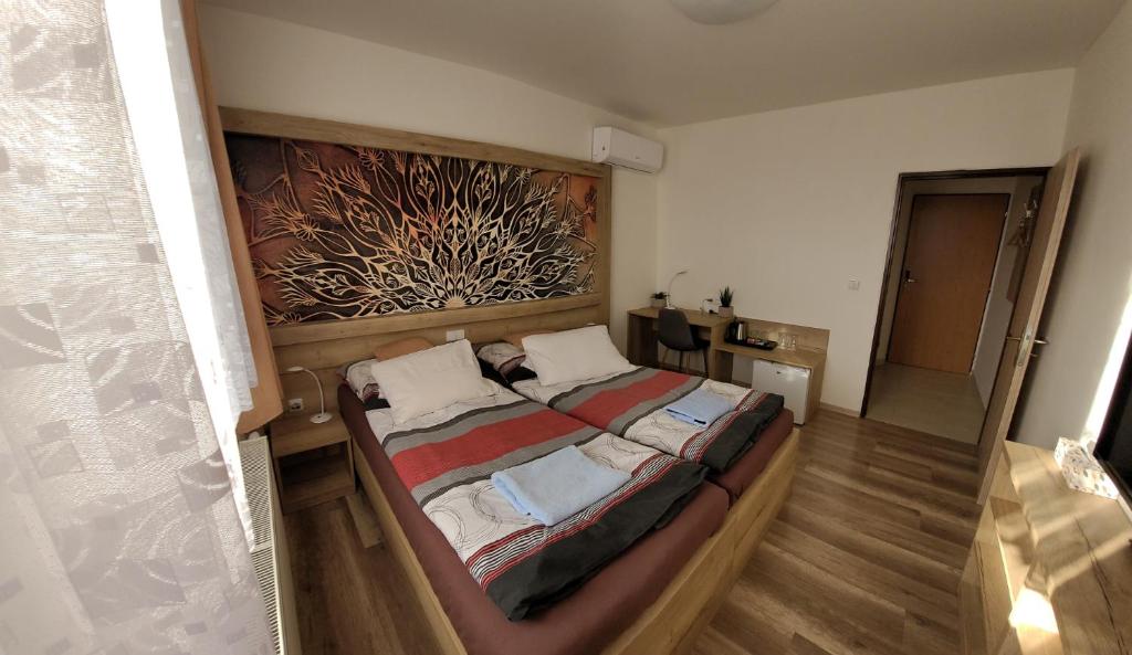 Posteľ alebo postele v izbe v ubytovaní Hotel Gól Prostějov
