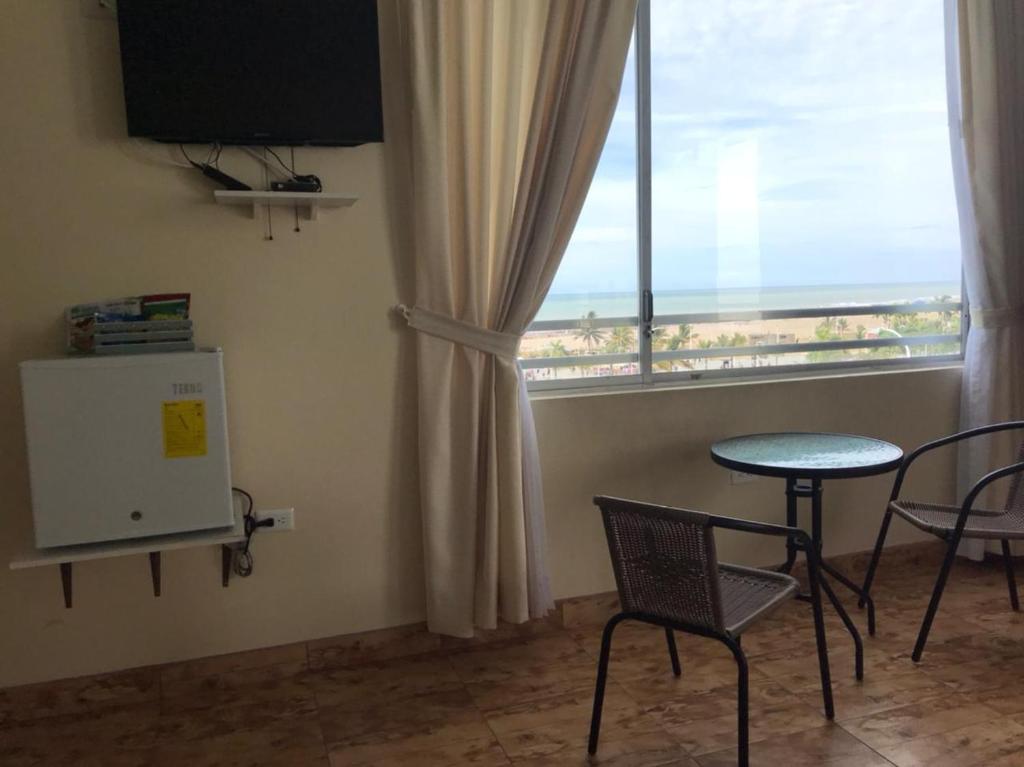 TV a/nebo společenská místnost v ubytování Hotel Las Palmas