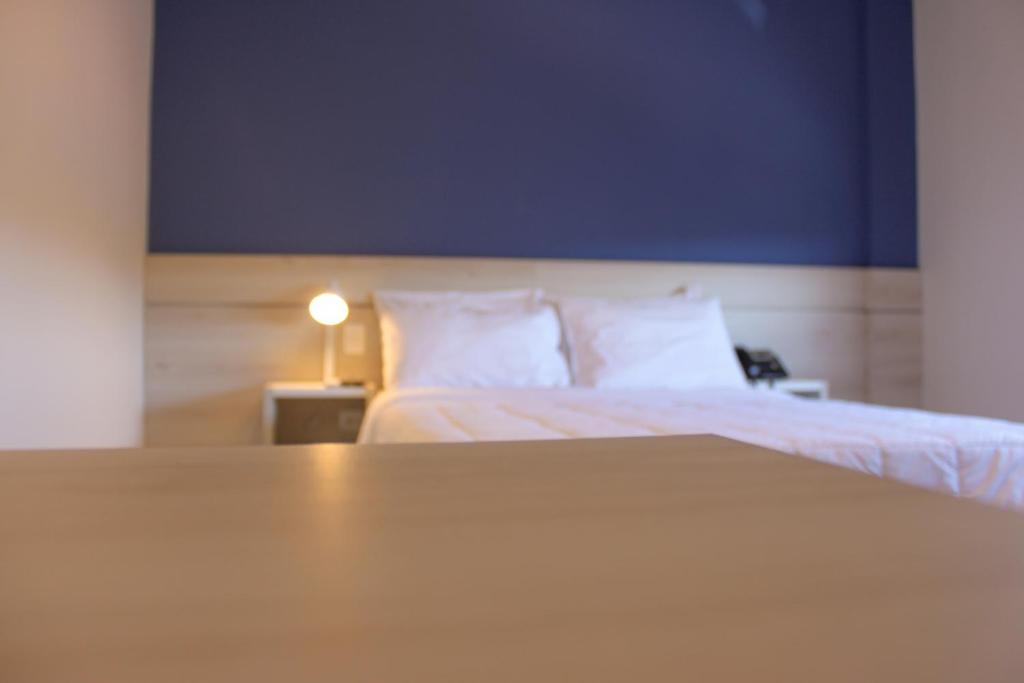 Postel nebo postele na pokoji v ubytování Nova Hotel