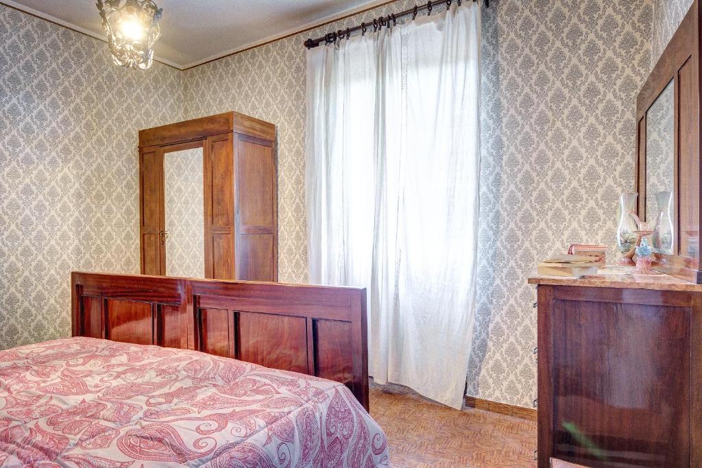 Postel nebo postele na pokoji v ubytování L’Arco