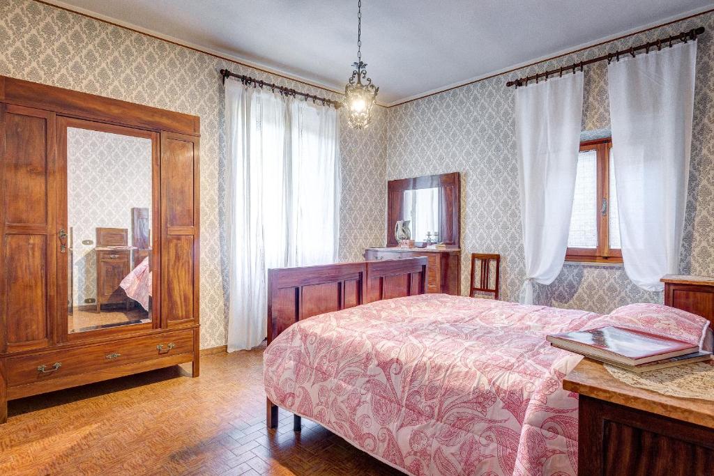Postel nebo postele na pokoji v ubytování L’Arco