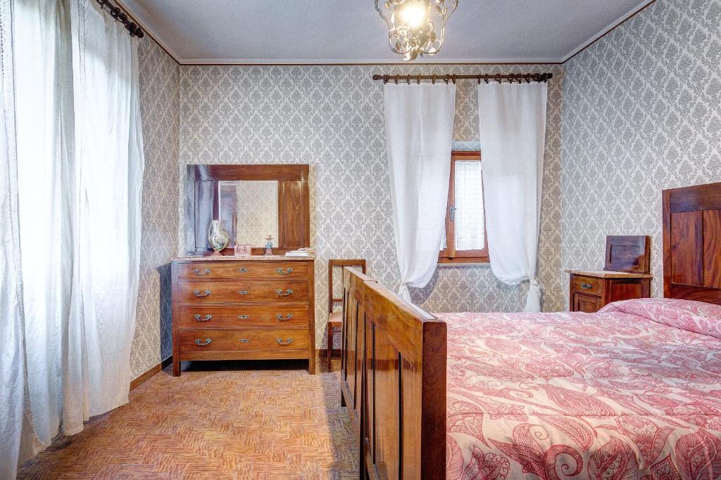 Postel nebo postele na pokoji v ubytování L’Arco