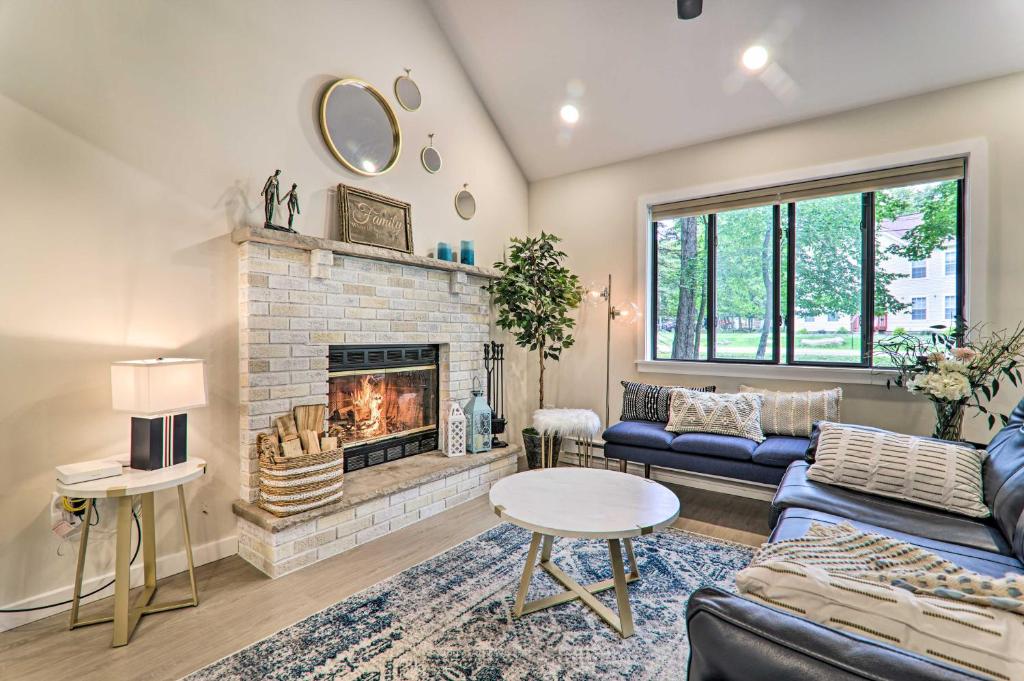 a living room with a couch and a fireplace at Relax Fireside! Retreat 15 Mi to Camelback Slopes in Tobyhanna