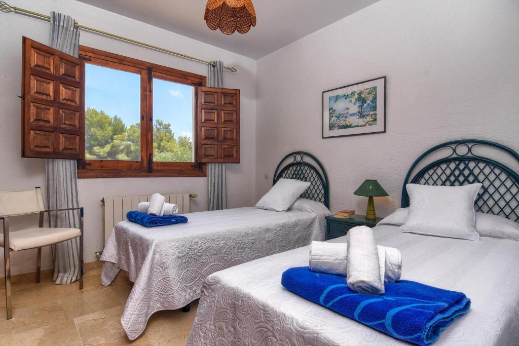 Posteľ alebo postele v izbe v ubytovaní Villa Margarita - A Tranquil Oasis with Large Private Pool