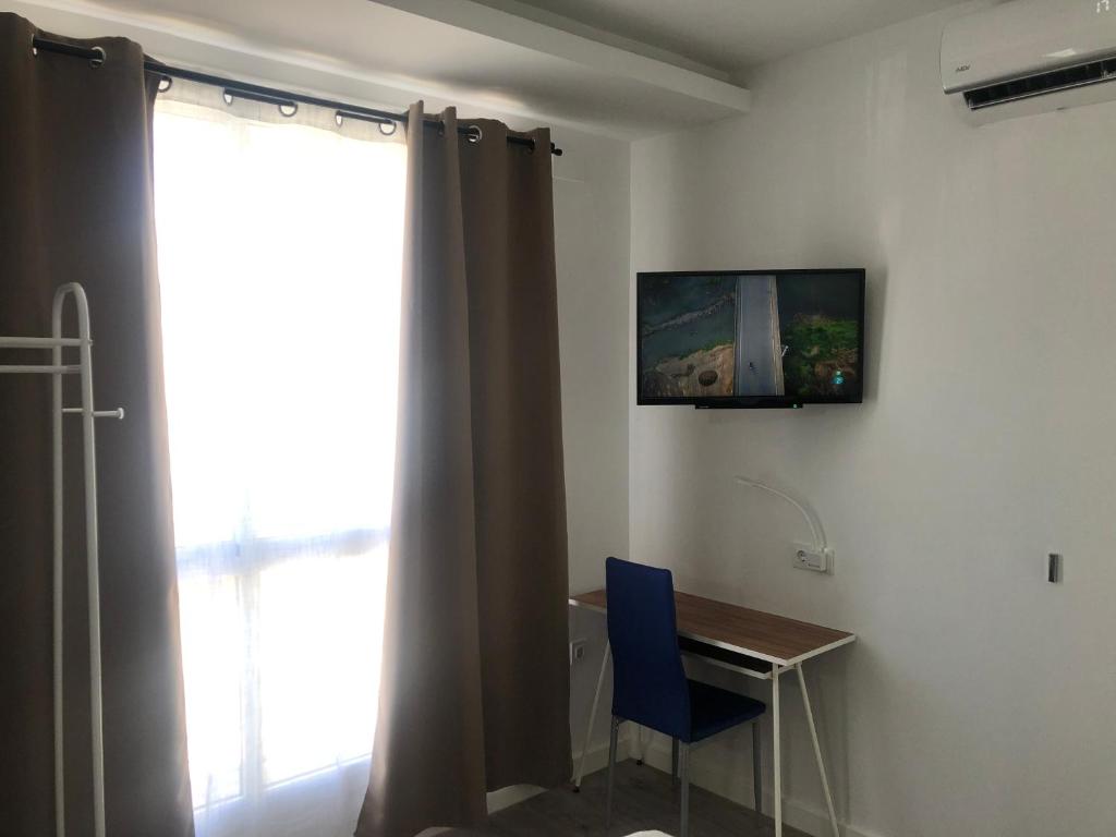 Televízia a/alebo spoločenská miestnosť v ubytovaní La Estación